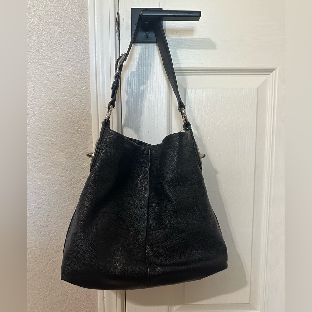 Medium size black leather coach purse.